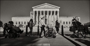 Group of ADAPTers lined up in front of a federal building